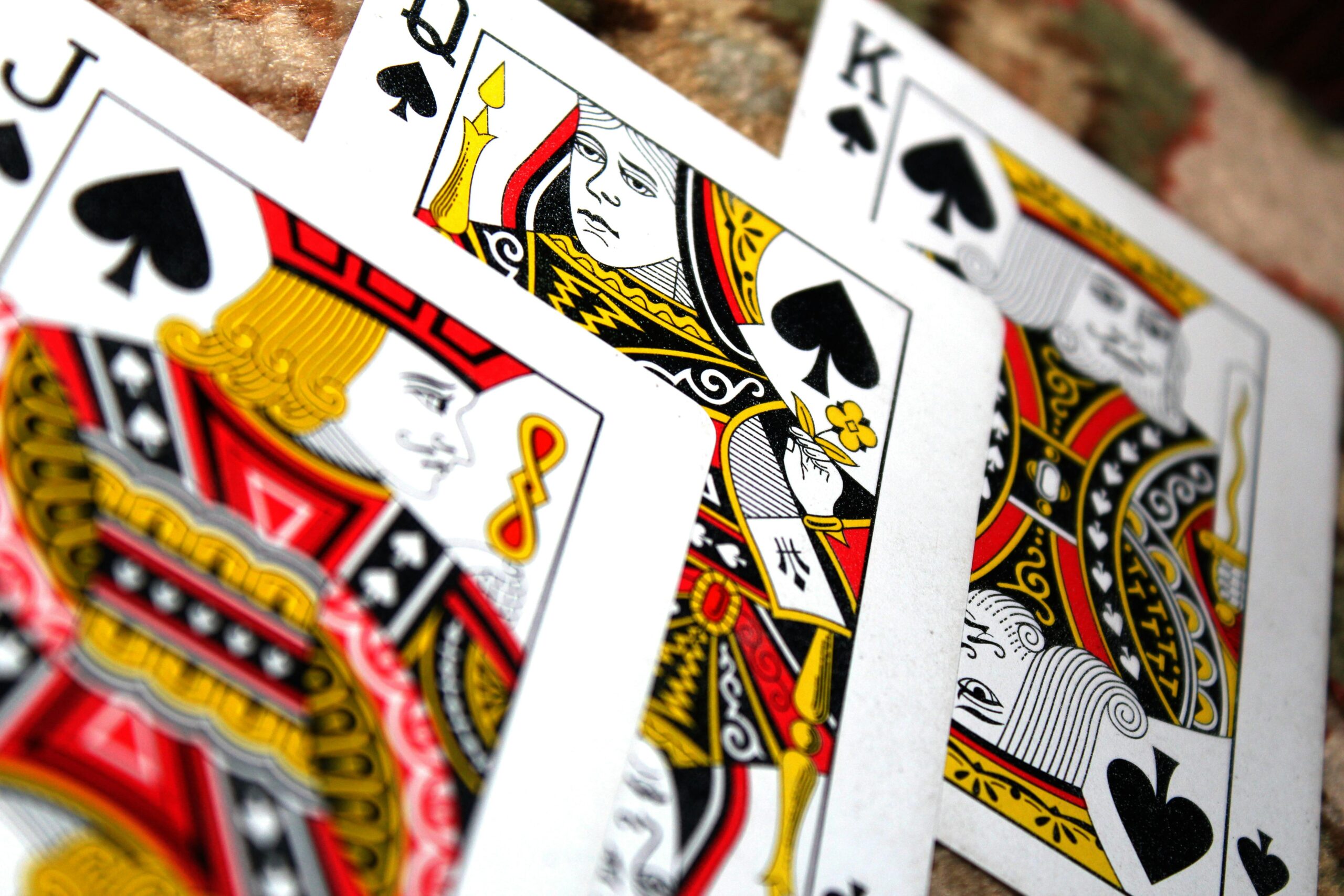 Detailed close-up of face cards in spades suit, ideal for gambling themes.